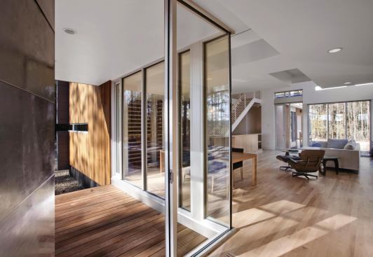 The house's two-story open-plan core provides natural light and outdoor views in all four directions.
