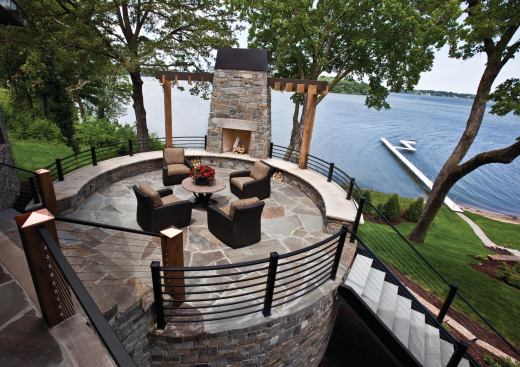 Situated on a bluff setback, the patio is poised between the upper terrace and the lower lawn.