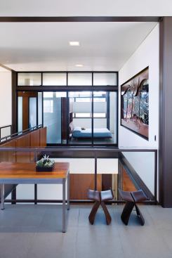 A view across the atrium and into the master bedroom. Architect Mark Macy placed the home's major rooms on the top floor.