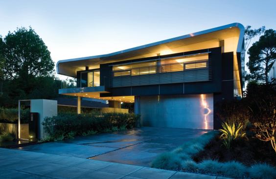 Visitors are greeted in the outdoor terrace beneath the protective overhang, which parallels the street to complete the neighborhood "edge."