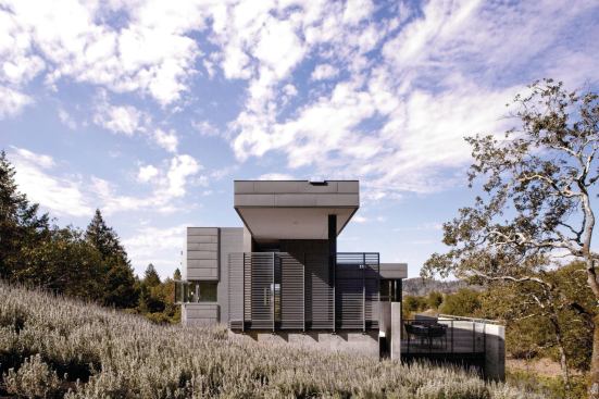 The entry elevation presents a bold composition of rectilinear forms.

