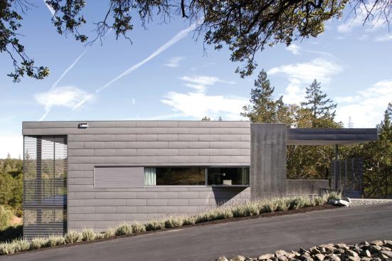 

Strong geometrical forms and soft, muted colors give this new house an assertive yet respectful presence in its rural landscape.