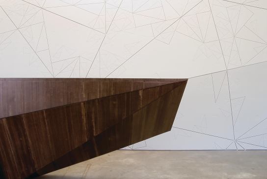 The Bemis Center's reception desk--laminated hardboard with exposed edges over a plywood and steel frame--doubles as a bar surface for gallery events.