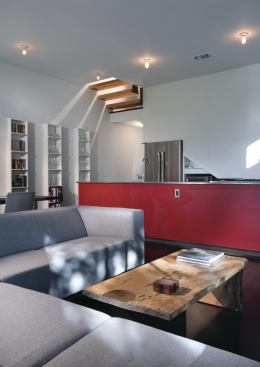 Unexpected interior sightlines, such as the view from the living room up through the second-floor staircase...