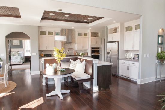 The Birchwood's gourmet kitchen offers a central island with sink, large walk-in pantry, built-in seating, and beadboard ceiling.  