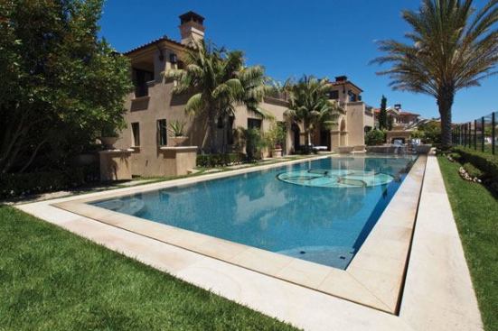 A Perfect Heart: This pool merges Tuscan and modern design that features limestone decking and a lotus-inspired design on the bottom of the pool.