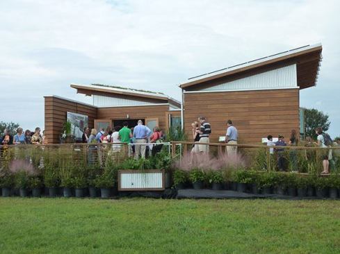 University of Maryland  WaterShed  Team website: 2011.solarteam.org Maryland’s WaterShed house won the architecture contest and the overall competition. Included in the team’s award-winning design are two primary outdoor spaces totaling 450 square feet. Both spaces—the entry courtyard and the kitchen pergola—sit on a direct axis from one another across the primary living spaces of the house to foster strong cross-ventilation, weather permitting.
