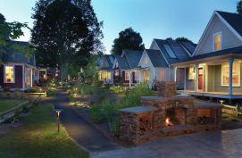 At the end of a row of cottages, a fireplace and screened pavilion is used for family picnics and spontaneous happy hour