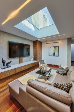Up and Down: A window was placed at the bottom of the pool to provide a visually interesting skylight to the basement of the home.