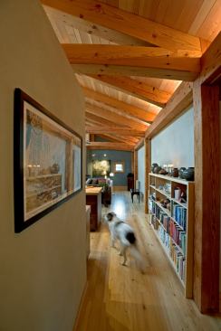 The house's main entrance hall leads directly into "The Commons," where the family spends much of its time relaxing, playing, cooking, and eating.