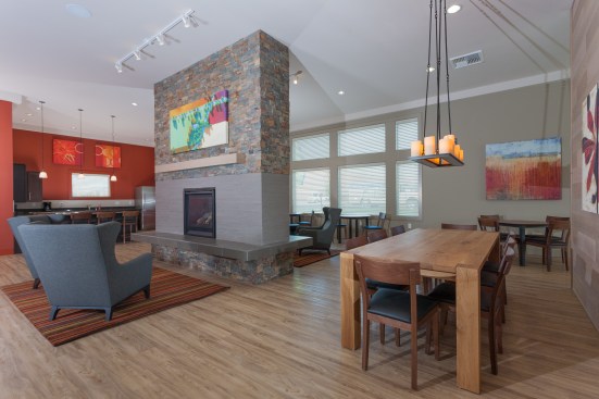 A fireplace and dining area invite social interaction.