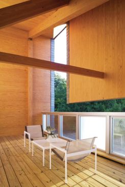 Large operable windows, generous terrace spaces, and sliding glass doors add to the open feeling and facilitate indoor/outdoor living and increased ventilation.