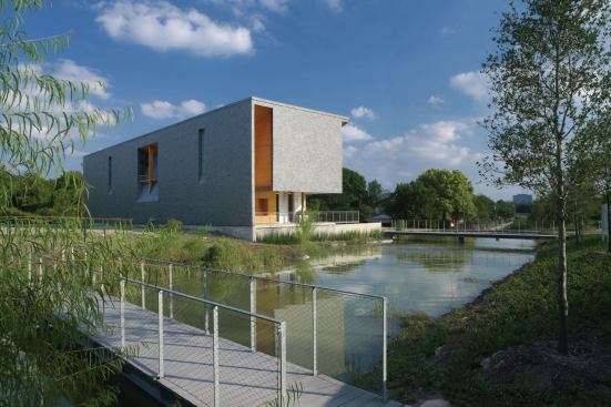 A small retention pond on the northwest corner of the lot collects overflow from the home's 10,000-gallon rainwater cistern.