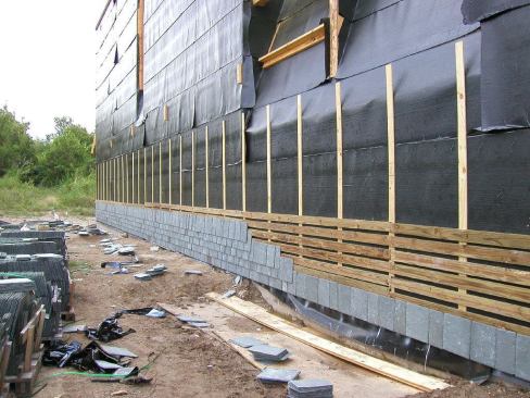 The slate cladding was carefully ventilated during construction to prevent moisture buildup inside the walls.