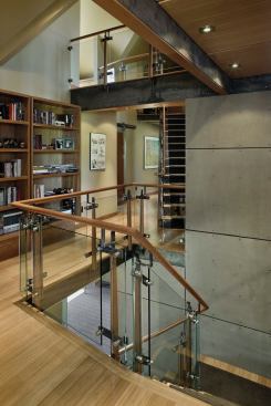 A new glass stair rail opens the center of the house to light from above.