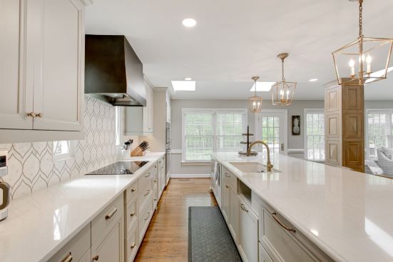 Stark white kitchens are being replaced by warmer whites and ivories.