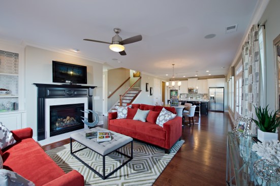 The family room of the Ashley model in the Jamestown community of Alpharetta, Ga., opens into a large kitchen. All of the homes in this community come with professional landscape maintenance included.