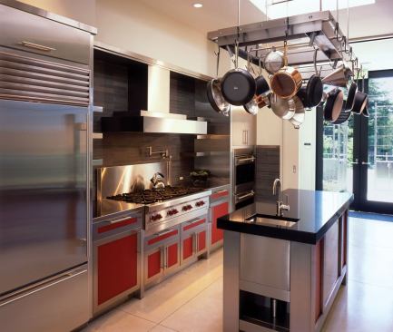 Red kitchen cabinet panels are made from red fabric sandwiched between three layers of resin.