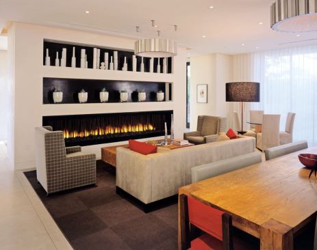 This larger room is used for private living and corporate events and features a drop-down projection screen at the fireplace.