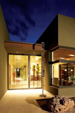 Locally sourced lumber, native plantings, and rainwater collection for irrigation soften the buildings' environmental impact.