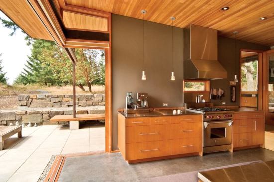 A green roof tops this San Juan Island, Wash., home, designed by Prentiss Architects of Seattle and built by Ravenhill Construction. The project features a disappearing corner (above) to maximize opportunities for outdoor living.
