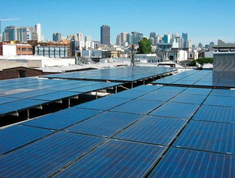 The office's rooftop holds an array of photovoltaic panels.