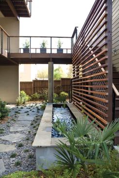 Permeable hardscape and low-water plantings lessen the site impact of development.