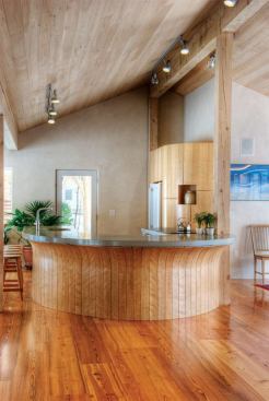 Upgrades to this existing house include a super-tight building envelope, heat-recovery ventilation, a ground-source heat pump powered by photovoltaic panels, LED lighting, solar-thermal domestic hot water, and local, salvaged, and FSC-certified materials.