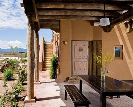 An eating area connects the outdoor space between the master bedroom module and the main living area.