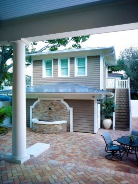 The detached two-car garage holds a second-floor bedroom and bathroom. The home’s Pella Architect series low-E windows feature HurricaneShield glass, which can withstand an impact equivalent to a 2x4 traveling at 50 feet per second, the company says.