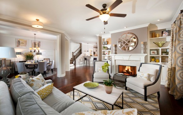 An open floor plan in the Essex model at the sold-out Woodbridge Crossing community in Selma, Ga., joins an oversized family room with a formal dining room.