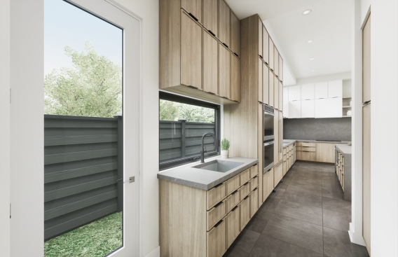 Directly off the main kitchen but tucked away behind a wall, the prep kitchen includes the pantry, a serving niche with a sink, and ample cabinetry. 